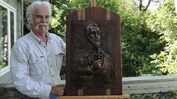 Dennis Berriochoa Downes with the sculpture of his ancestor, St Valentin.