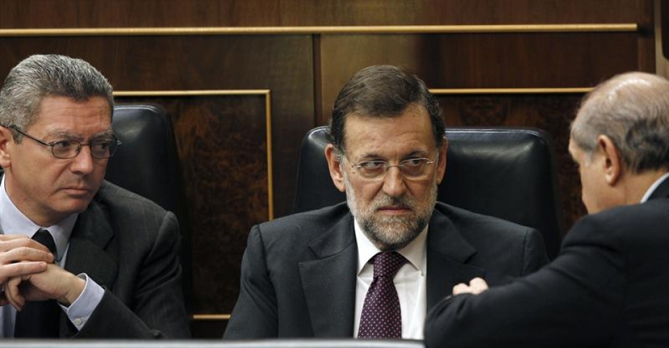 Mariano Rajoy con el ministro del Interior y el ministro de Justicia. Foto: Efe