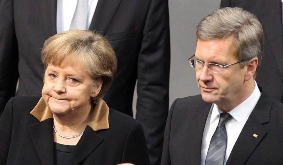 Wulff junto a la canciller Angela Merkel.