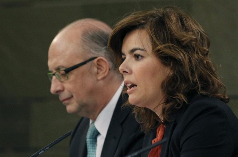 Soraya Sáenz de Santamaría y Cristobal Montoro. Efe.