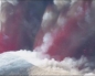 Mount Etna erupts, deep crimson lava and grey ash bursts into sky