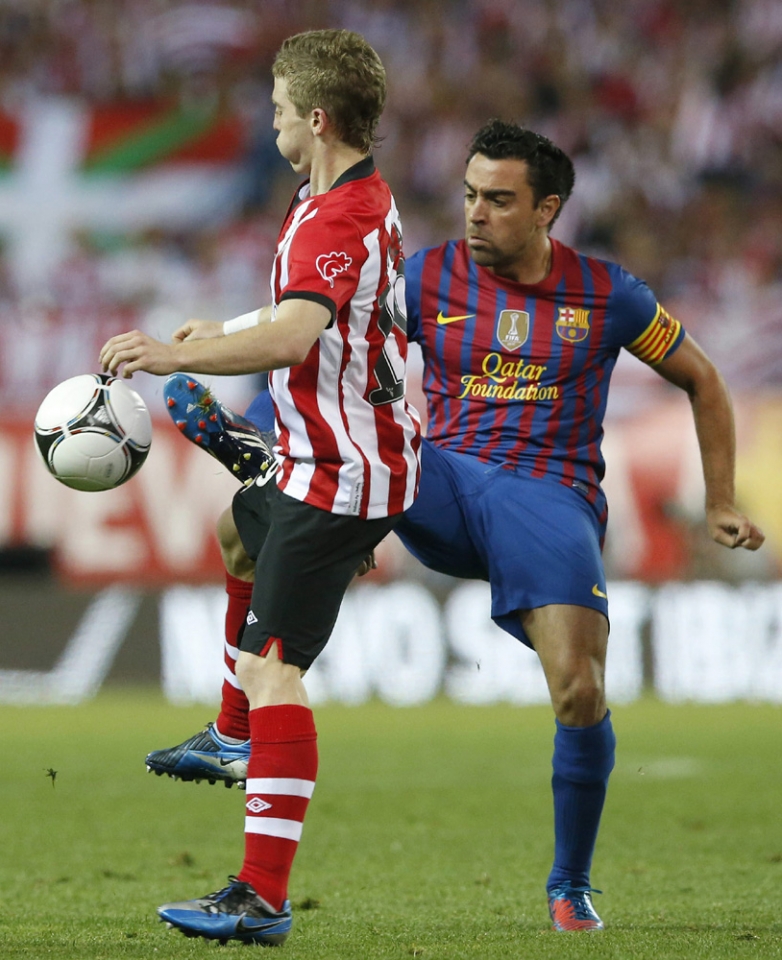 Munian y Xavi. Foto: EFE