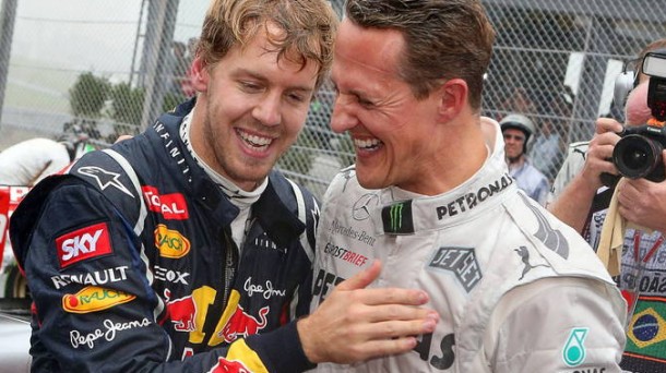 Michael Schumacher junto a Sebastian Vettel, actual campeón del mundo de Fórmula Uno. Efe.